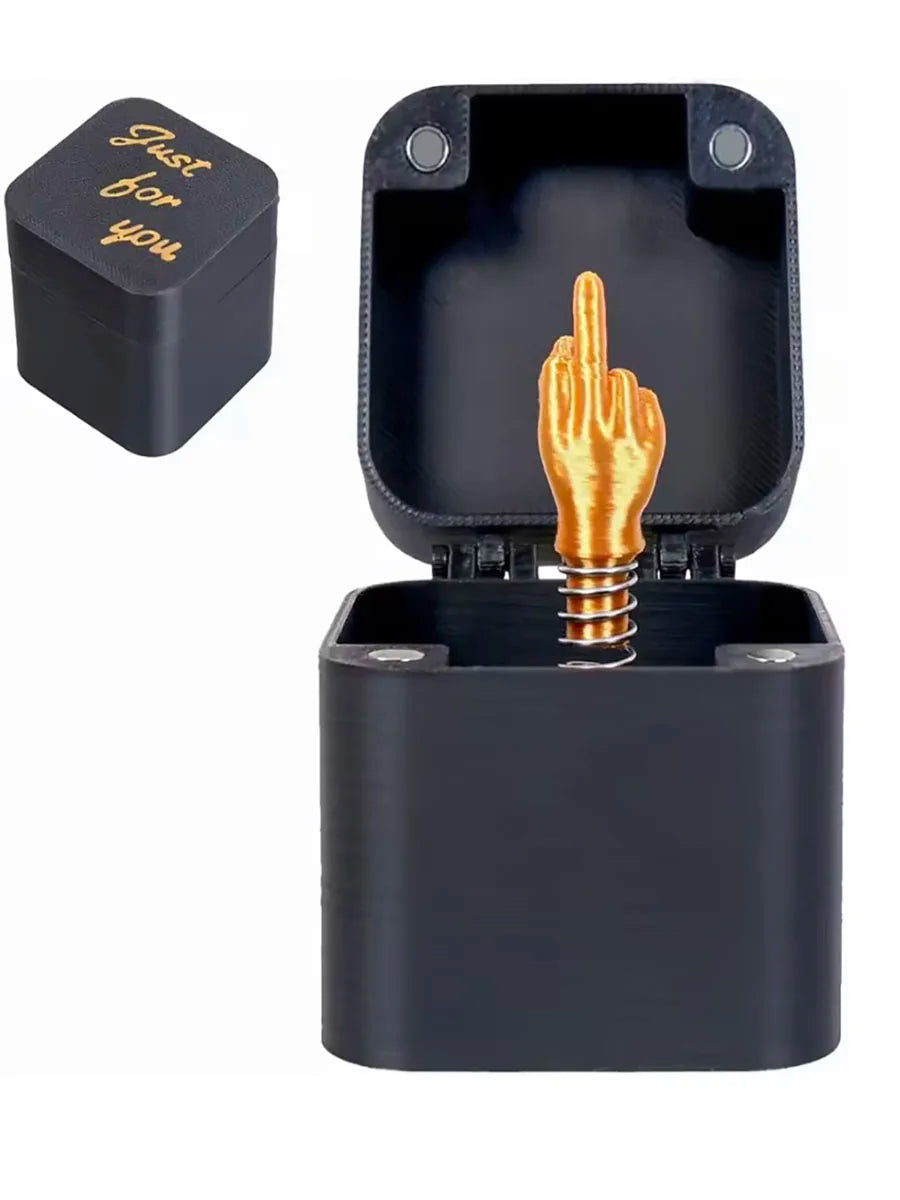 Black middle finger pop-up prank gift box with gold-coloured surprise