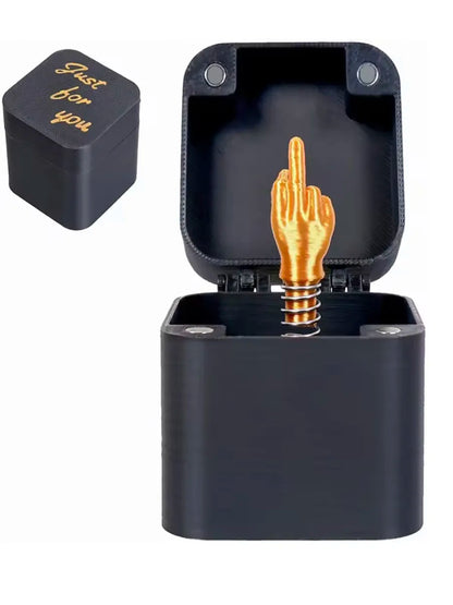 Black middle finger pop-up prank gift box with gold-coloured surprise